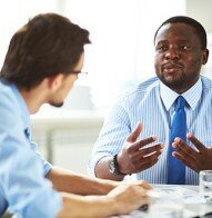Tutor teaching adult learner