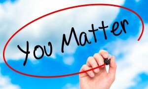 The words "You Matter" drawn in a blue sky with fluffy white clouds